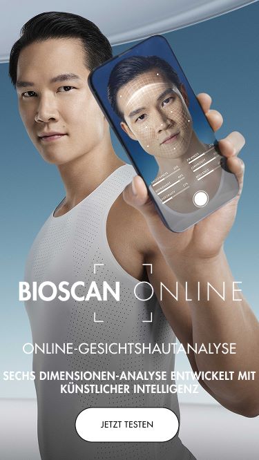 Person hält Smartphone; Gesicht auf Bildschirm. Text: "BIOSCAN ONLINE - ONLINE-GESICHTSHAUTANALYSE - SECHS DIMENSIONEN-ANALYSE ENTWICKELT MIT KÜNSTLICHER INTELLIGENZ - JETZT TESTEN."